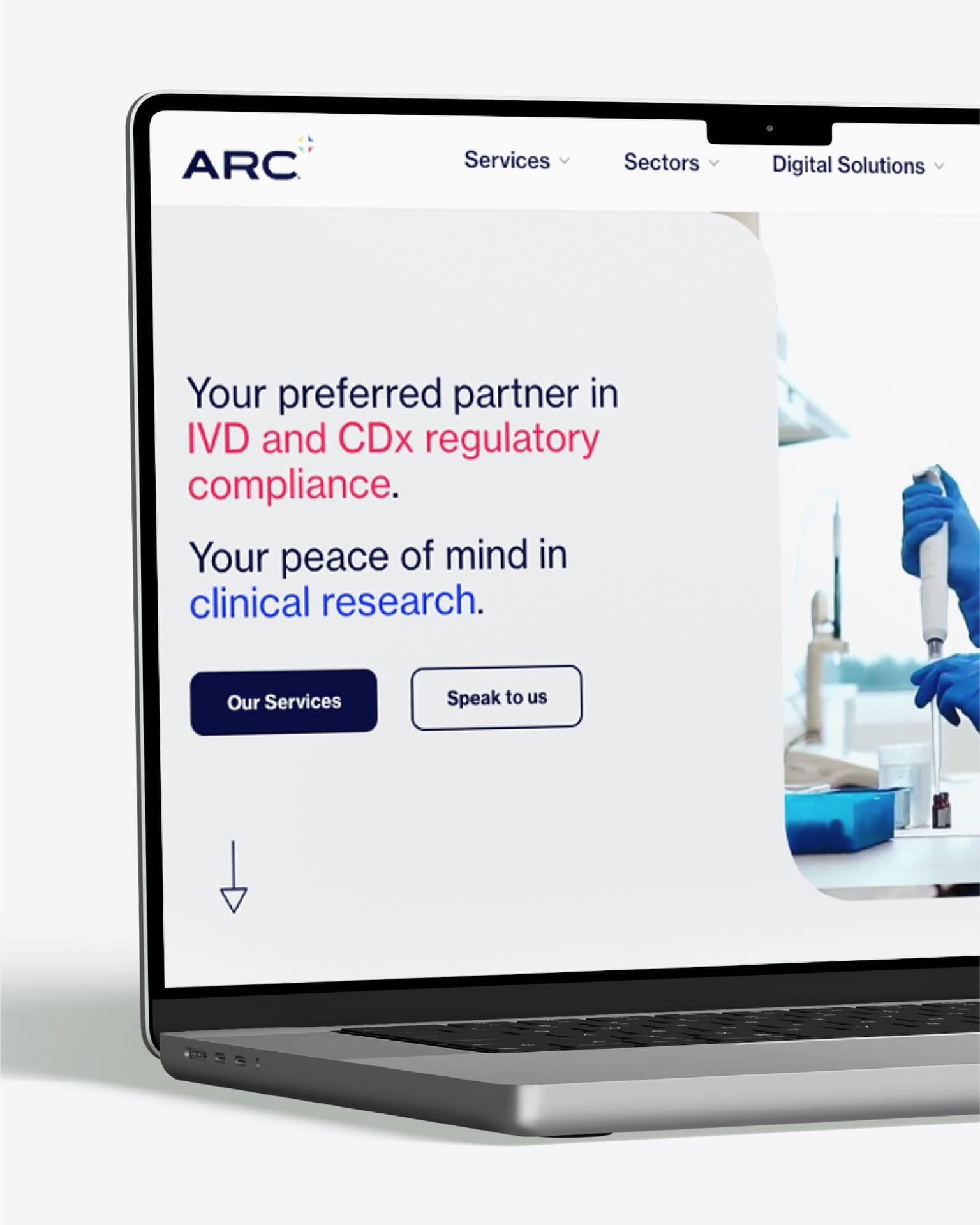 ARC homepage on a laptop with headline “Your preferred partner in IVD and CDx regulatory compliance” and “clinical research.”